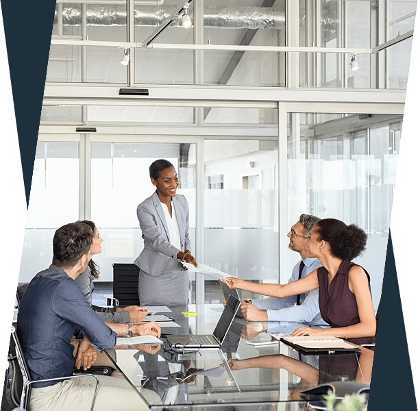 Businesswoman presenting ideas to colleagues in a modern office meeting.