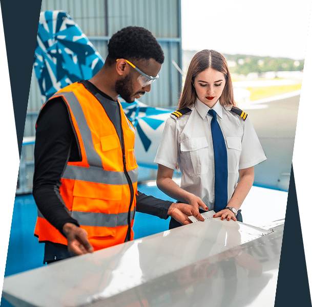 Pilot and technician inspecting airplane wing.